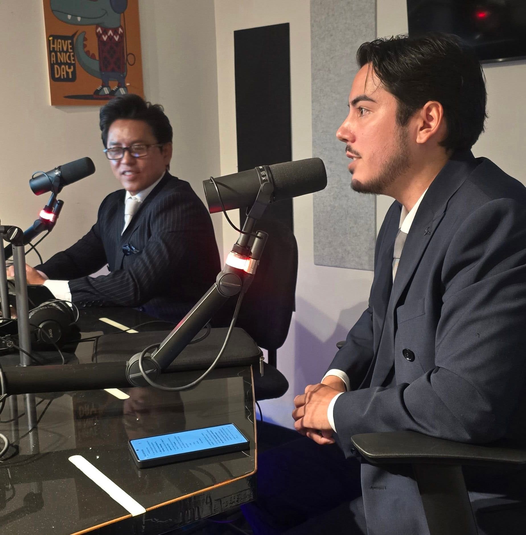 Duque Immigration team in the CKJS 92.7 studio